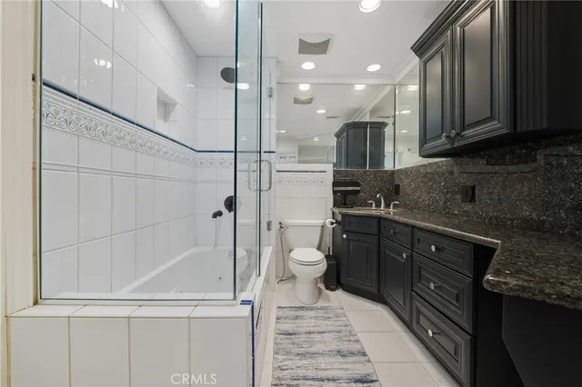 a view of a patio with table and chairs and potted plants