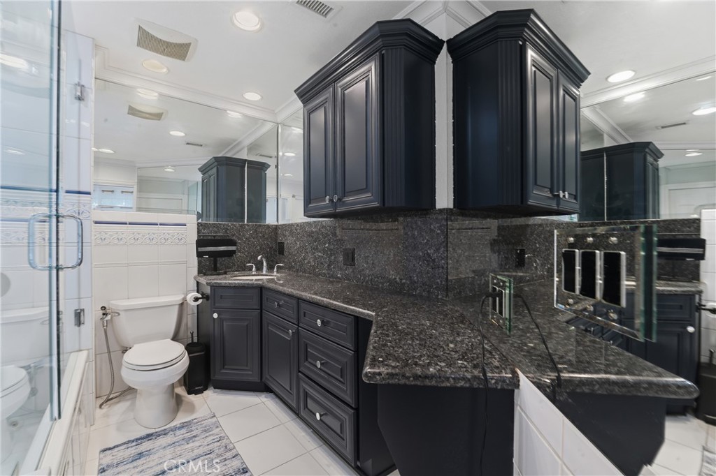 6070 East Summit Court Anaheim Hills, CA 92807 - Photo 47 of 60 a kitchen with stainless steel appliances granite countertop a sink stove and cabinets