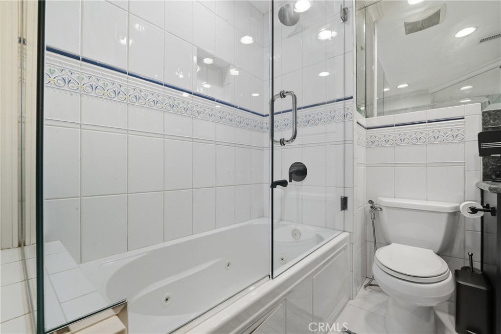 6070 East Summit Court Anaheim Hills, CA 92807 - Photo 48 of 60 a bathroom with a bathtub a toilet and a shower