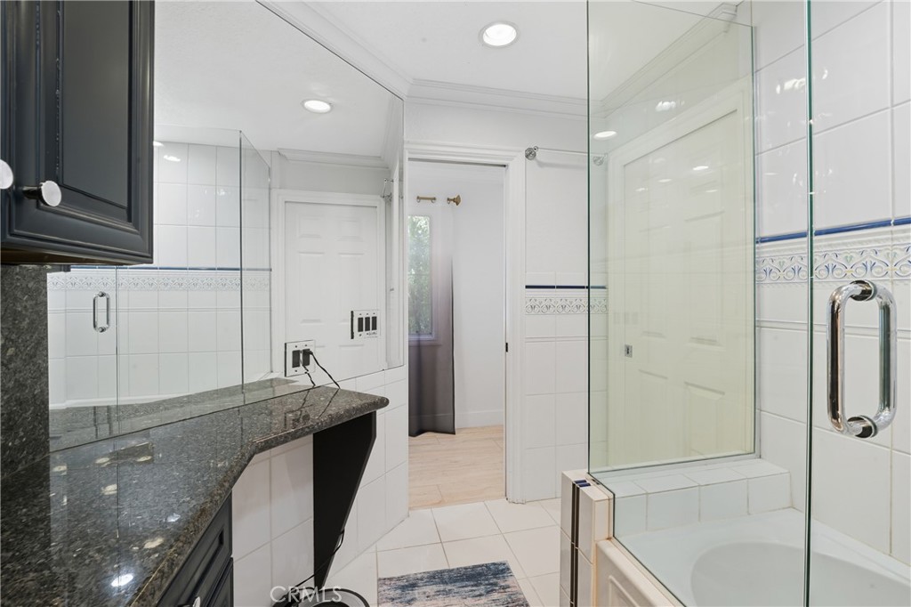 6070 East Summit Court Anaheim Hills, CA 92807 - Photo 49 of 60 a spacious bathroom with a granite countertop sink a toilet and shower