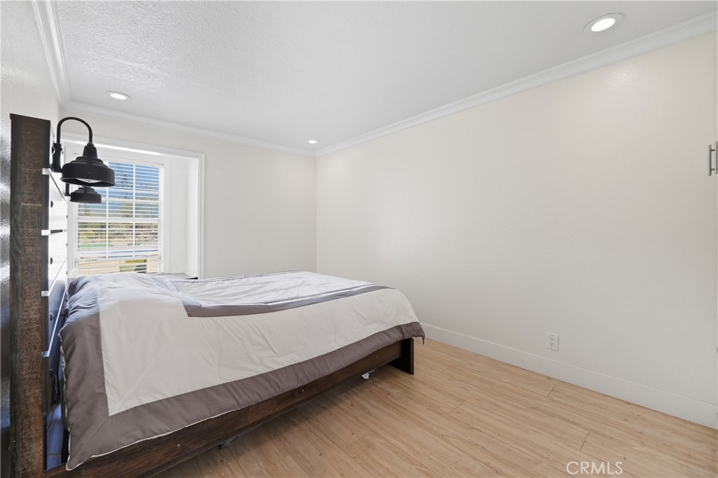 6070 East Summit Court Anaheim Hills, CA 92807 - Photo 50 of 60 a bed sitting in a bedroom next to a window