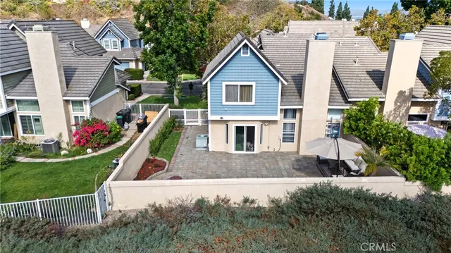 a front view of a house with yard and green space