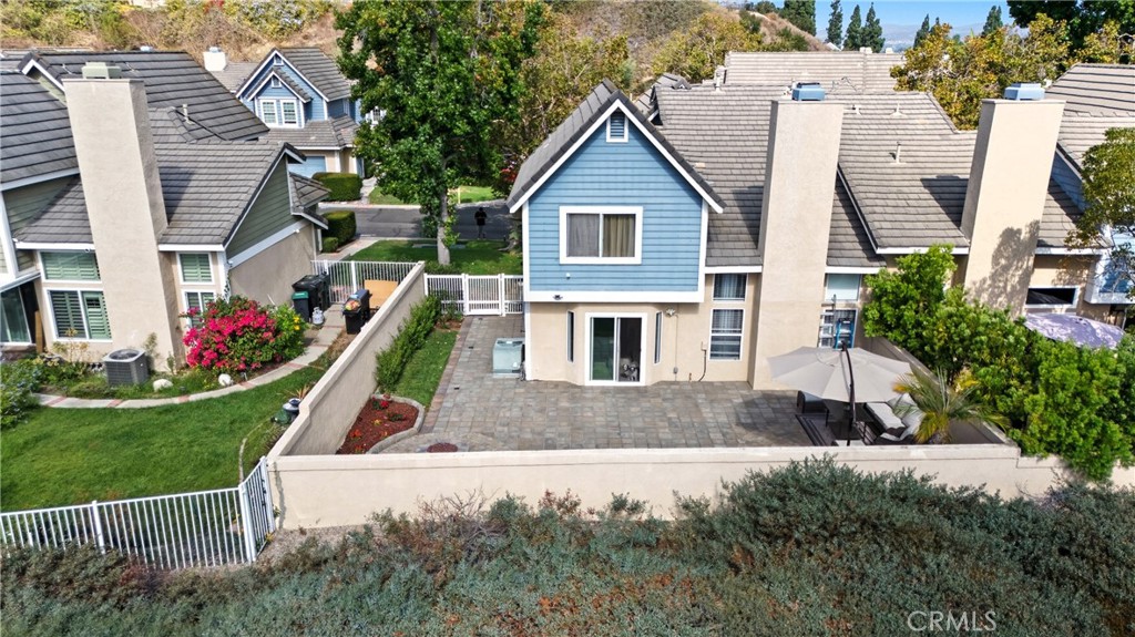 6070 East Summit Court Anaheim Hills, CA 92807 - Photo 5 of 60 a front view of a house with a yard