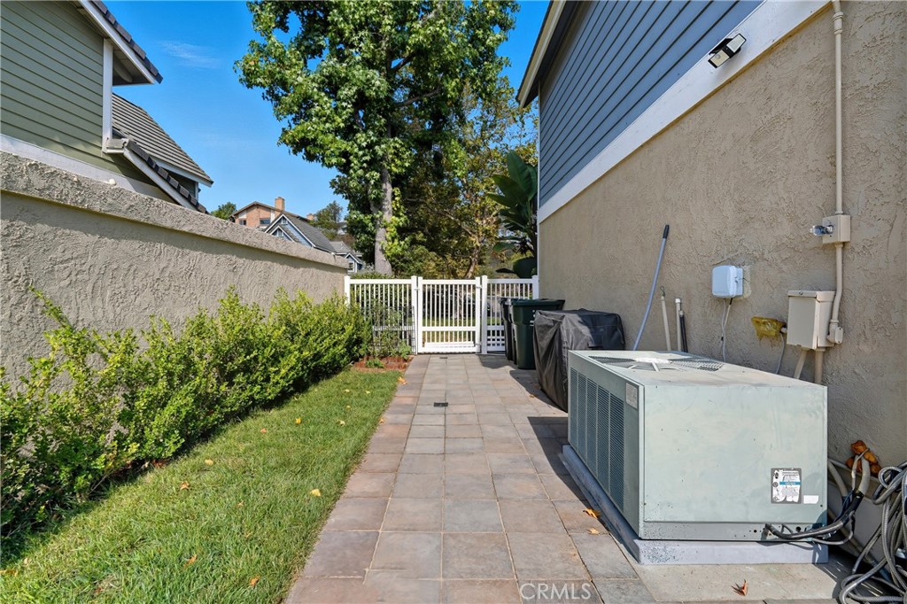 6070 East Summit Court Anaheim Hills, CA 92807 - Photo 55 of 60 a view of a patio with table and chairs and potted plants