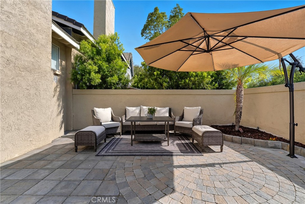 6070 East Summit Court Anaheim Hills, CA 92807 - Photo 59 of 60 a patio with a patio table and chairs