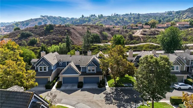 an aerial view of residential house with green space