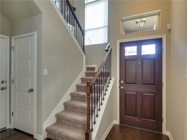 a view of entryway with wooden floor