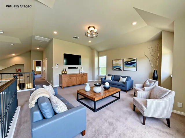 a living room with furniture fireplace and flat screen tv
