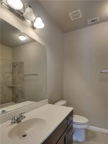 a bathroom with a sink and a toilet