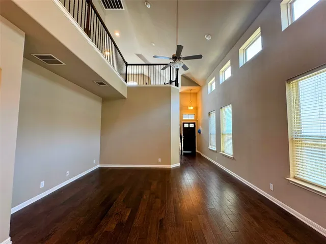 a large kitchen with a lot of counter space and stainless steel appliances