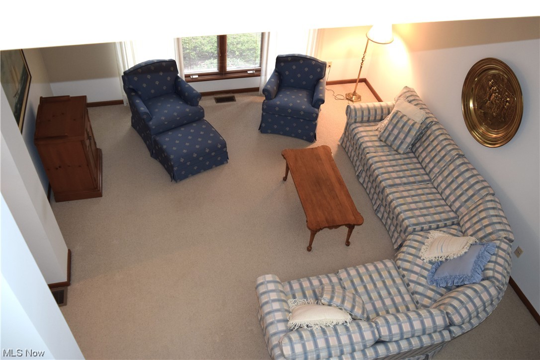 22522 Center Ridge Road, Unit E Rocky River, OH 44116 - Photo 6 of 22 View of the living room from the top of the staircase.