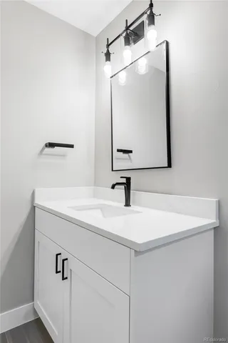 a bathroom with a sink and a mirror