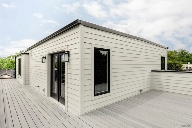 a view of a white house with wooden floor