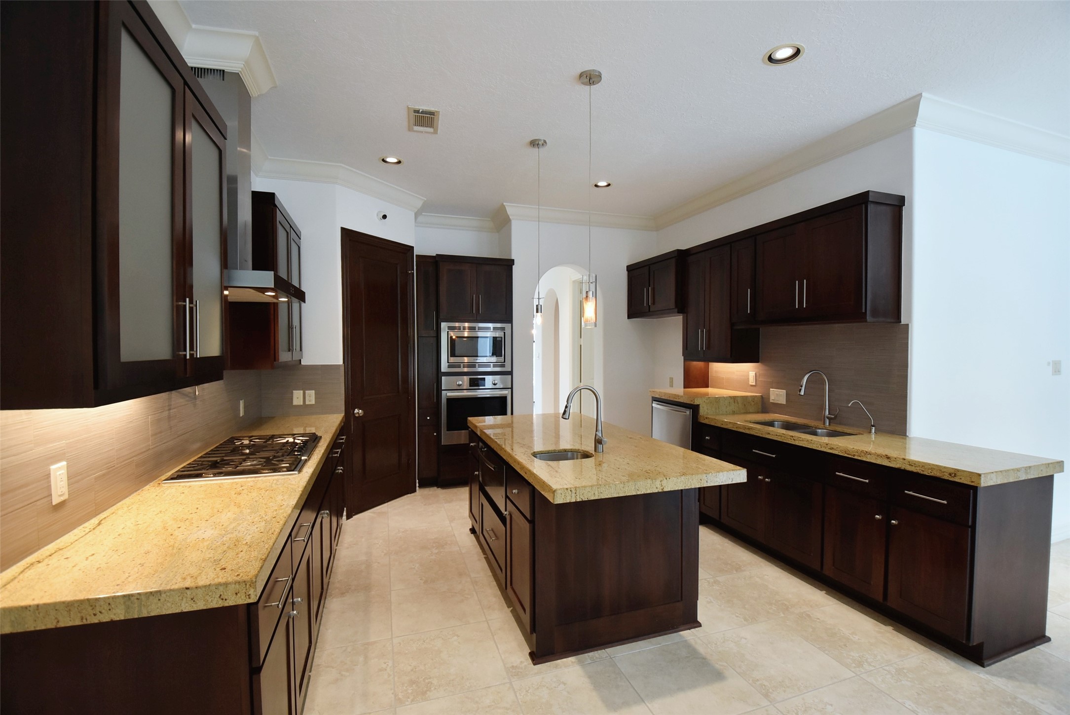 2014 Split Branch Court Houston, TX 77077 - Photo 11 of 47 a kitchen with granite countertop a sink stove and cabinets