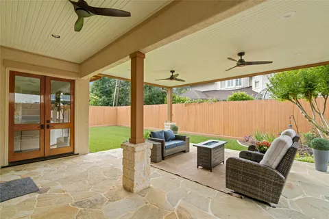 a outdoor living space with furniture and a garden view