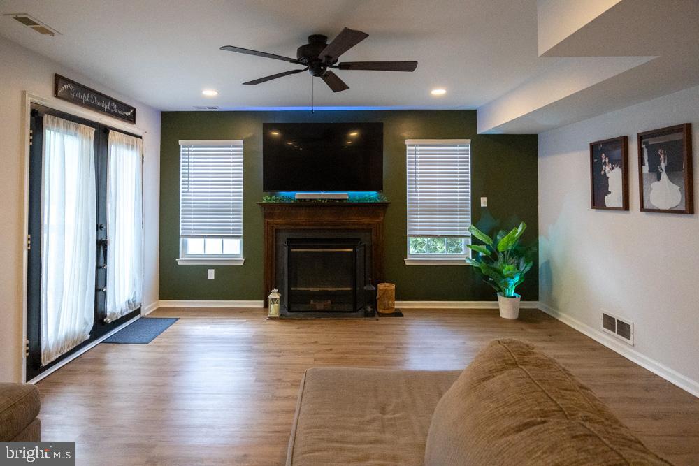 15 Timber Court Glassboro, NJ 08028 - Photo 13 of 32 a living room with furniture and a fireplace