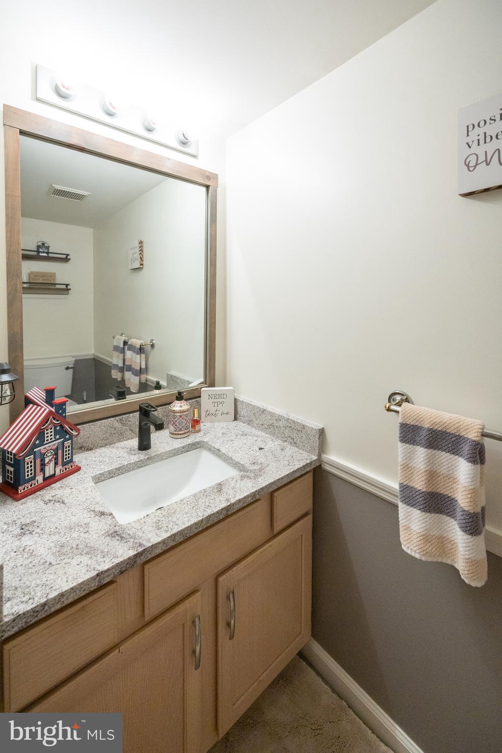 15 Timber Court Glassboro, NJ 08028 - Photo 19 of 32 a bathroom with a granite countertop sink and a mirror