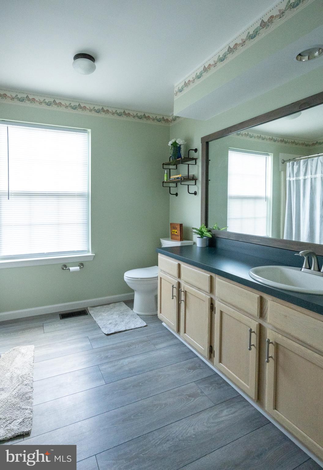 15 Timber Court Glassboro, NJ 08028 - Photo 22 of 32 a spacious bathroom with a double vanity sink a mirror and a window