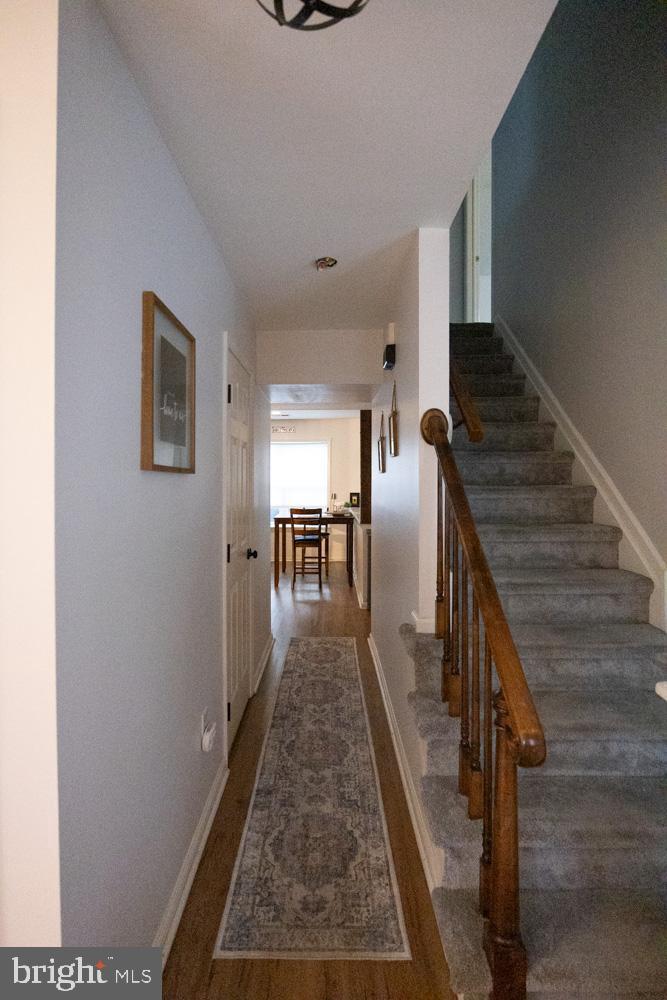 15 Timber Court Glassboro, NJ 08028 - Photo 6 of 32 a view of a hallway with wooden floor and stairs