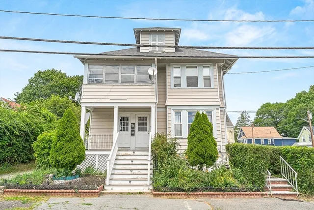a front view of a house with garage