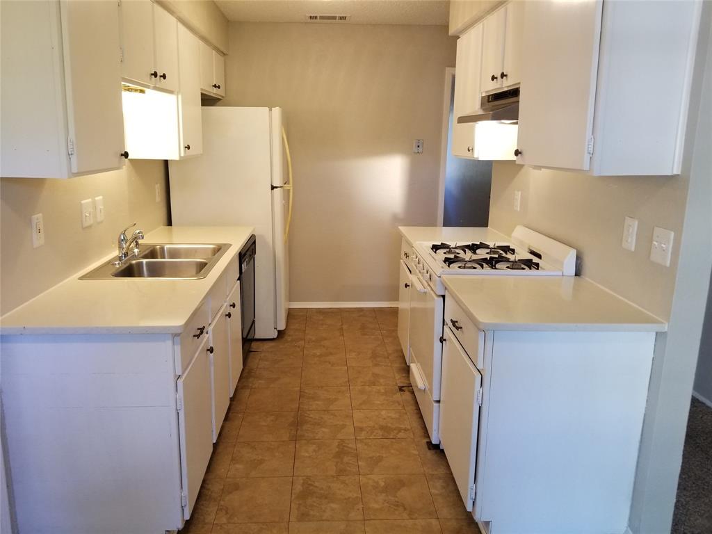5301 Indio Circle Austin, TX 78745 - Photo 13 of 16 a kitchen with stainless steel appliances a sink stove and refrigerator