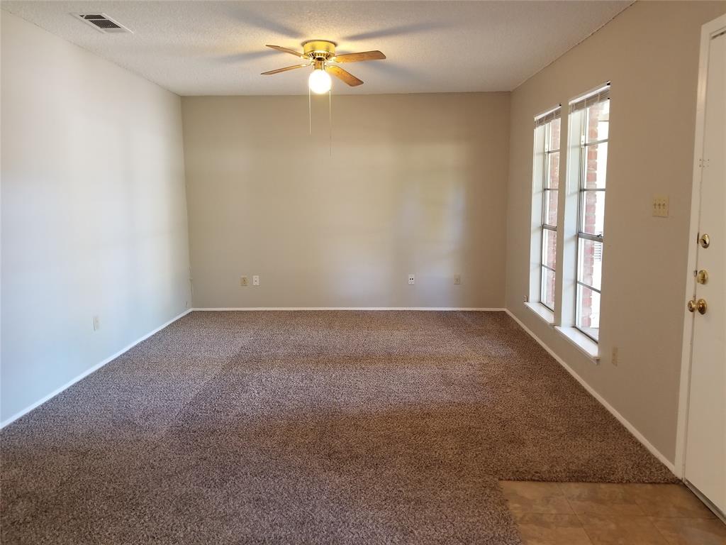 5301 Indio Circle Austin, TX 78745 - Photo 15 of 16 an empty room with a window and a ceiling fan
