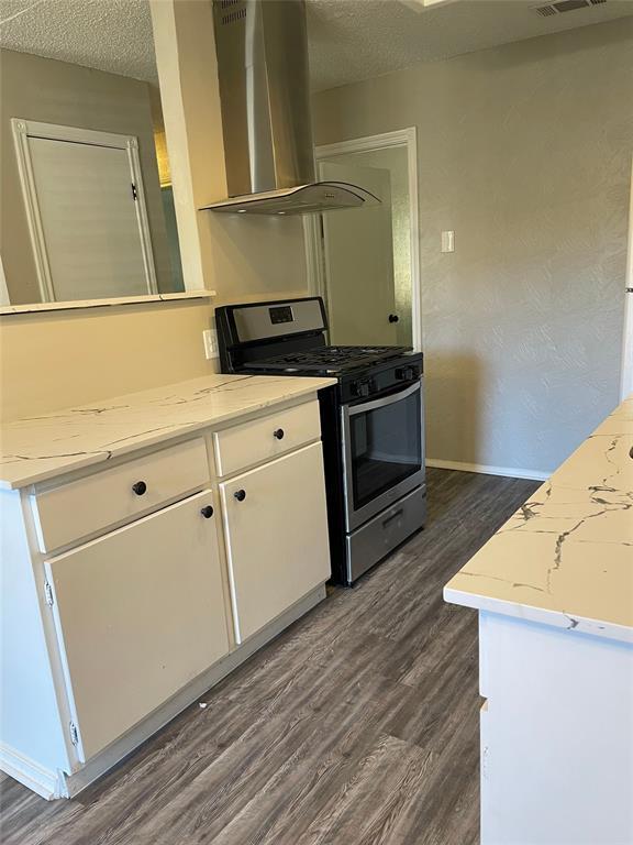 5301 Indio Circle Austin, TX 78745 - Photo 2 of 16 a kitchen with granite countertop a sink and a stove top oven