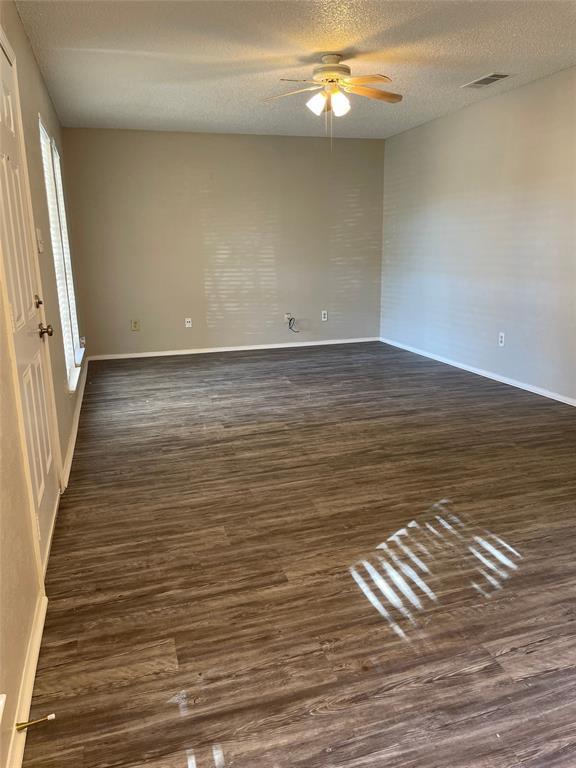 5301 Indio Circle Austin, TX 78745 - Photo 5 of 16 a view of empty room with wooden floor and fan
