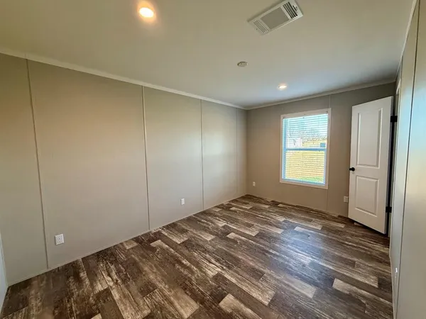 a view of room with window and hardwood floor