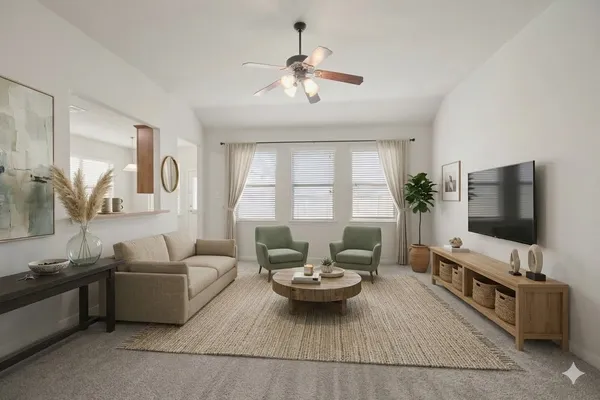 a living room with furniture and a flat screen tv