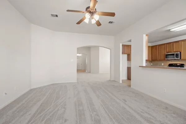 a view of a kitchen with a sink and a refrigerator