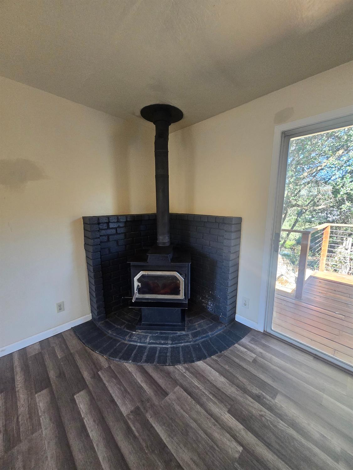 10601 Lime Kiln Road Grass Valley, CA 95949 - Photo 11 of 79 Wood burning stove surrounded by brick.