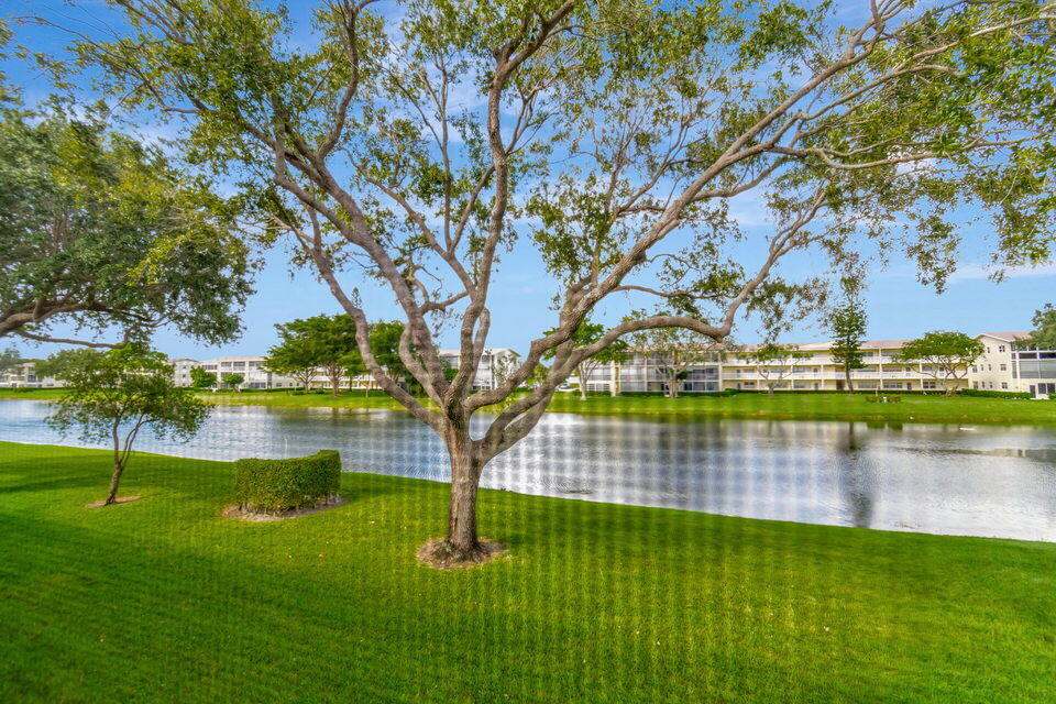 150 Dorset D, Unit 150 Boca Raton, FL 33434 - Photo 33 of 82 a view of lake with houses