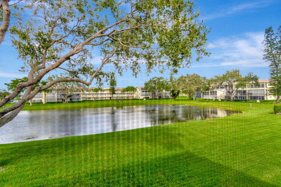 150 Dorset D, Unit 150 Boca Raton, FL 33434 - Photo 34 of 82 a view of lake with houses