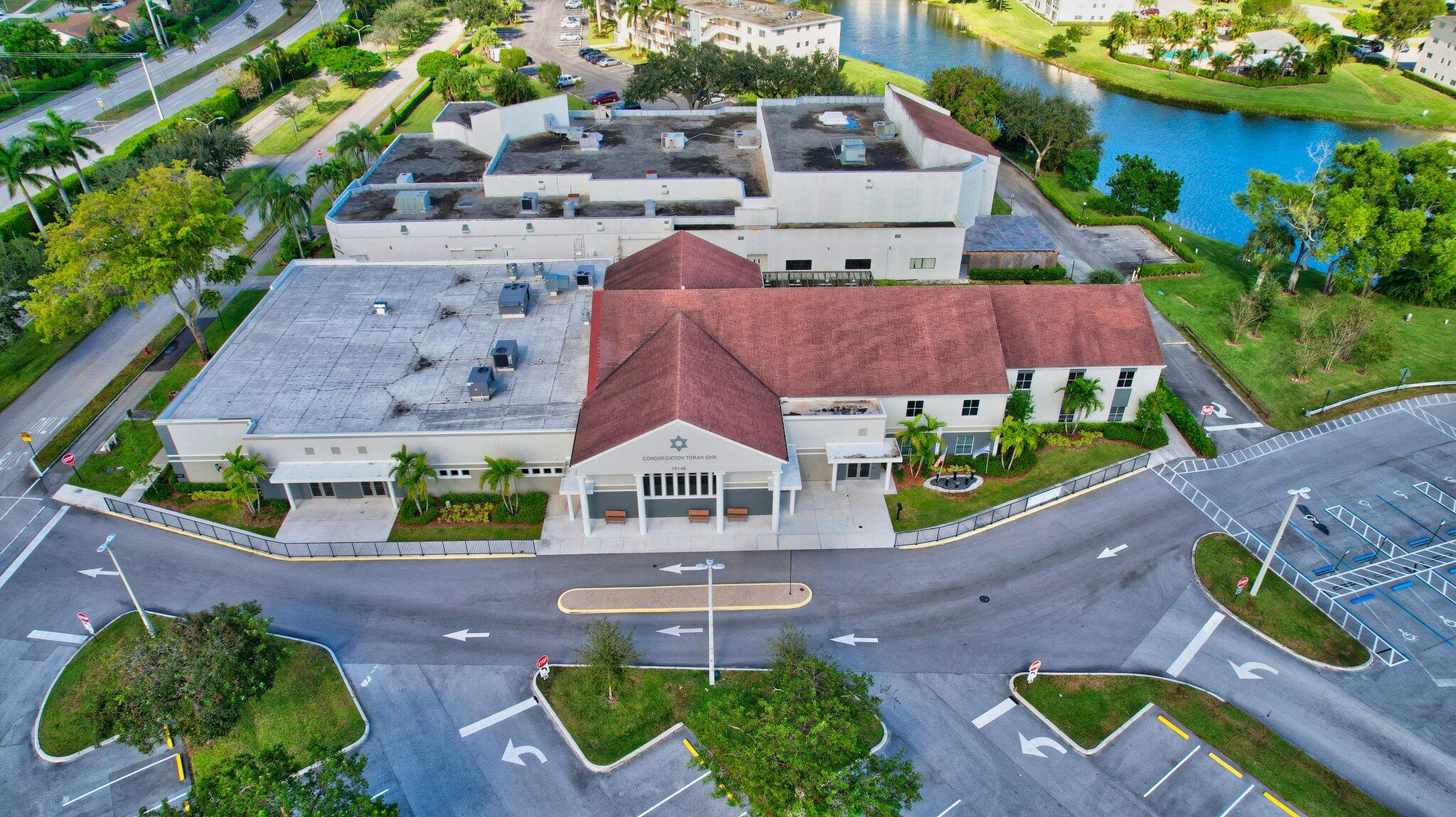 150 Dorset D, Unit 150 Boca Raton, FL 33434 - Photo 78 of 82 an aerial view of a house with garden space and street view