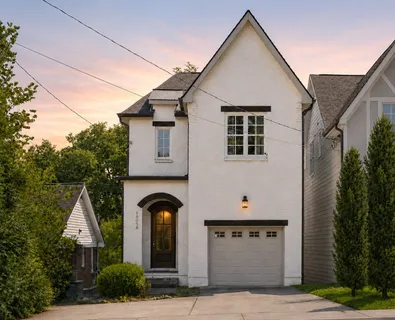 a front view of a house with garage