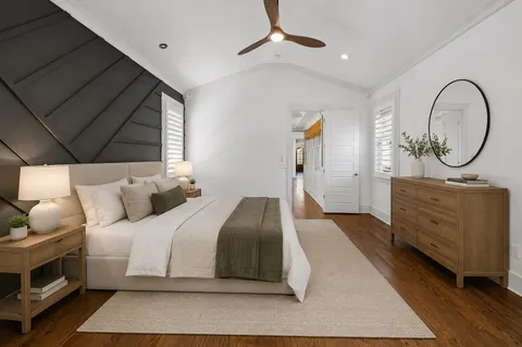a bedroom with a bed and a dresser