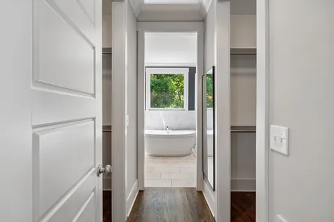 a view of a bathroom from a hallway