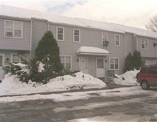 14 Scuppo Road, Unit D5 Danbury, CT 06811 - Photo 1 of 1 a front view of a house with yard and seating space