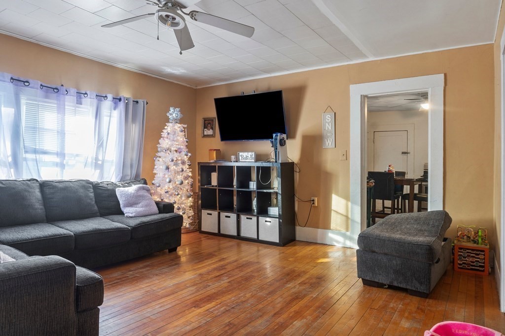 130 Myrtle Street Springfield, MA 01151 - Photo 8 of 25 a living room with furniture and a flat screen tv