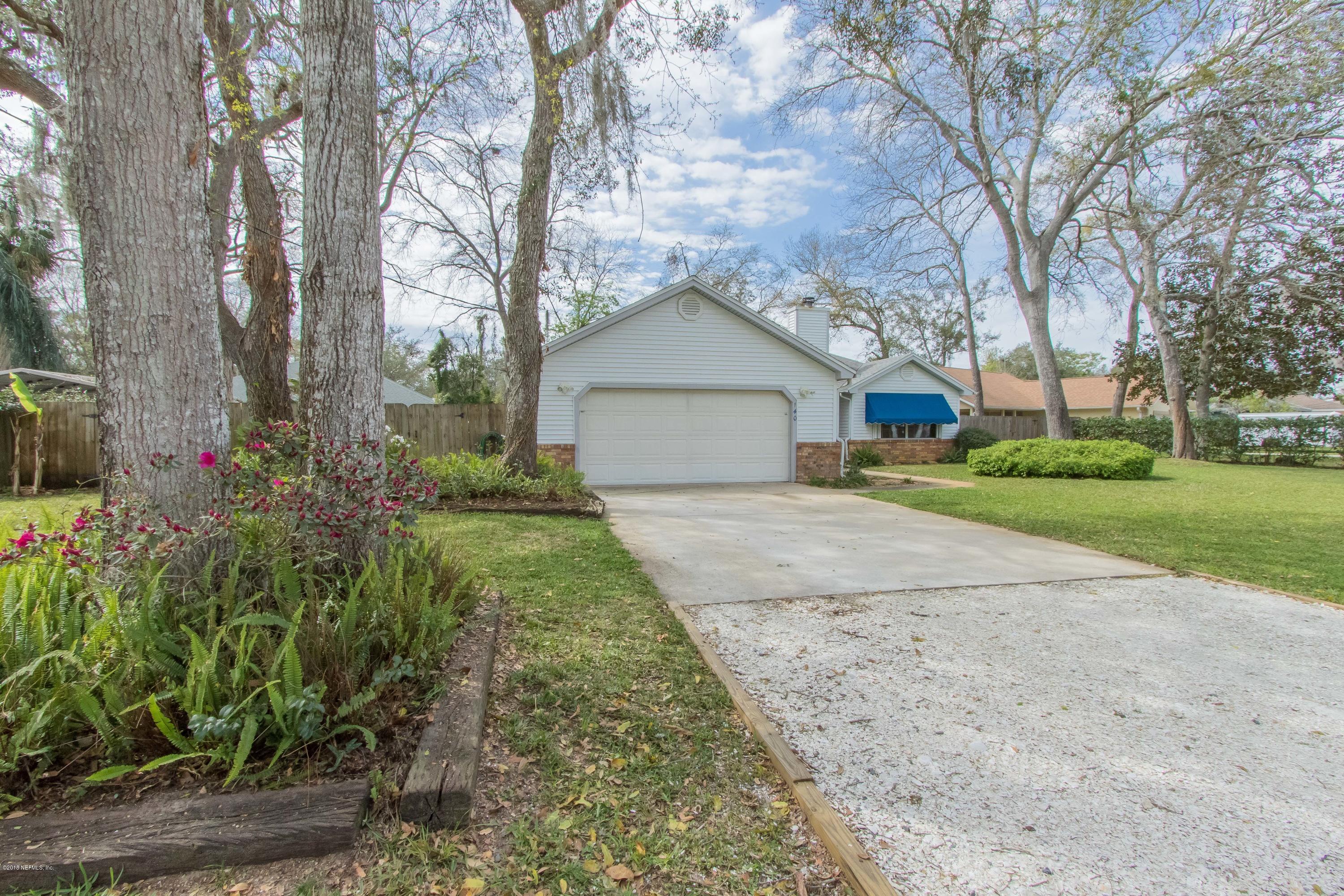 140 Nautilus Road St. Augustine, FL 32086 - Photo 3 of 42 front view of a house with a yard