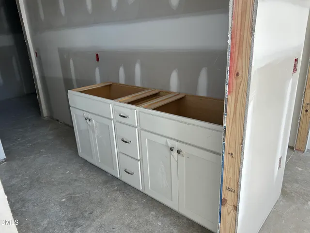a utility room with cabinets
