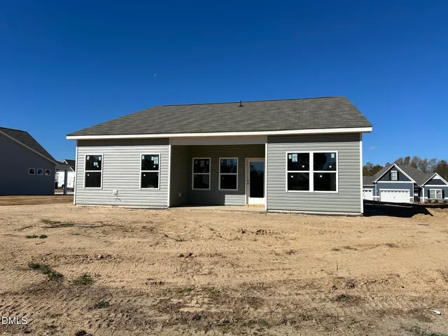 a house with trees in the background