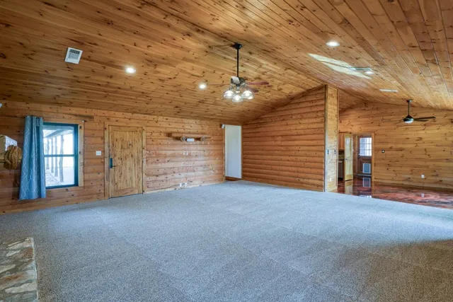 wooden floor in an empty room and a window