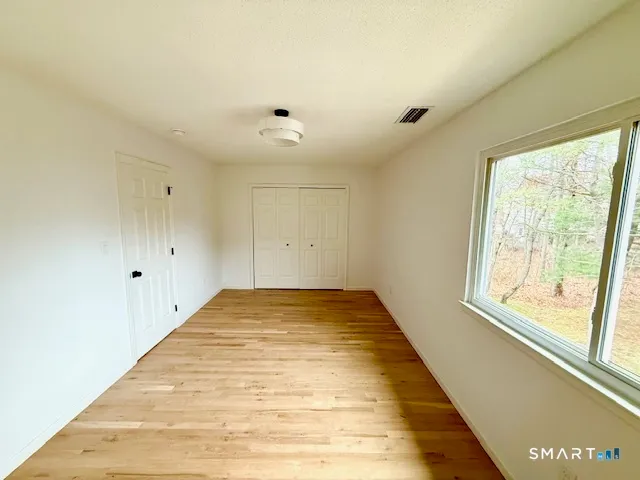 a view of a room with a large window