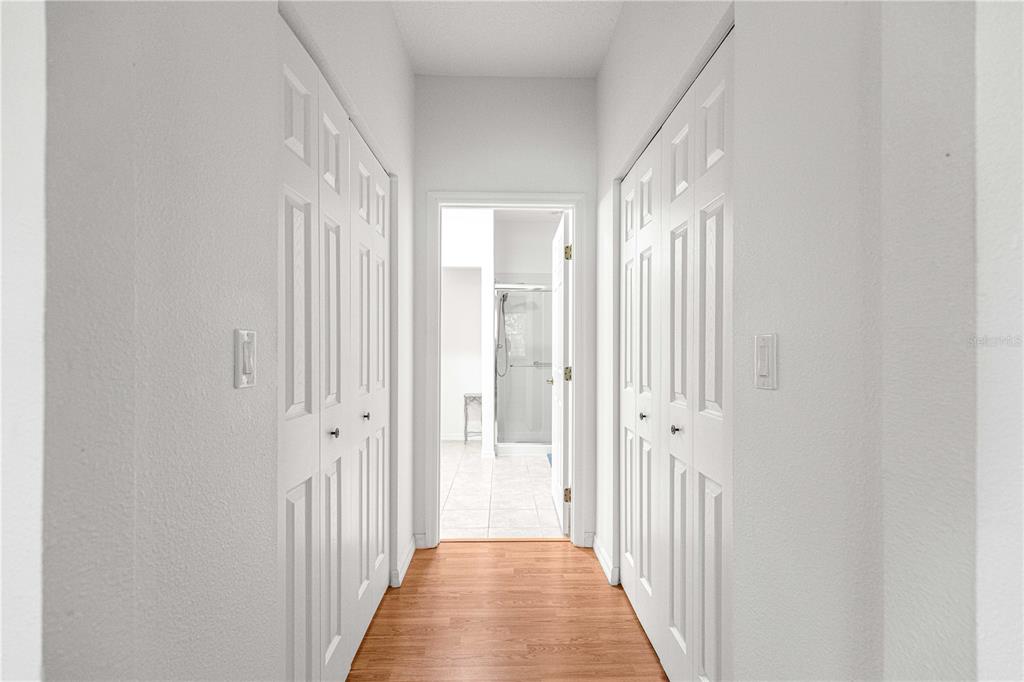 9317 Southwest 94th Loop Ocala, FL 34481 - Photo 19 of 40 a view of a hallway with a wooden door