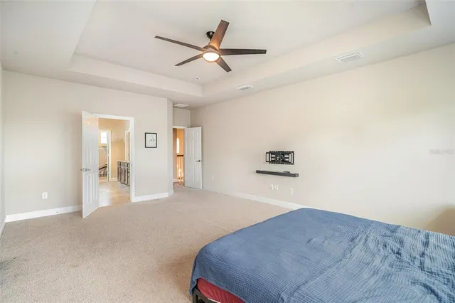 a large spacious bathroom with a granite countertop tub sink shower and mirror