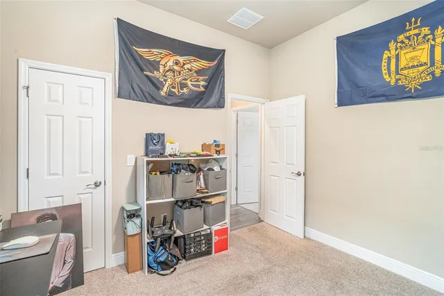 a bathroom with a granite countertop shower sink and toilet