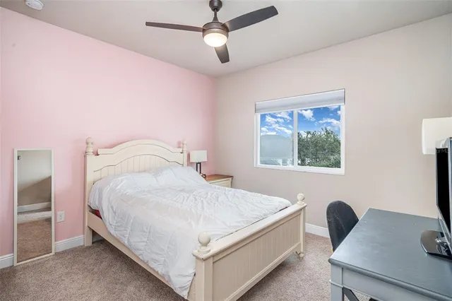 a bathroom with a granite countertop tub sink toilet and mirror