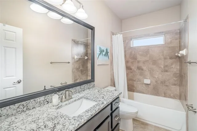 a view of a house with backyard and porch